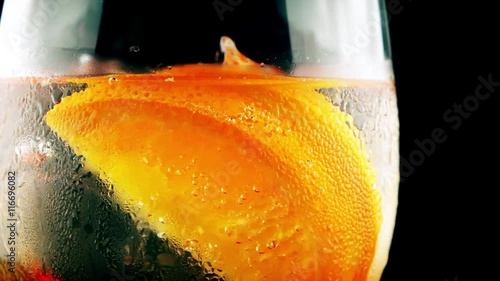 Refreshing ice summer cocktail with orange 