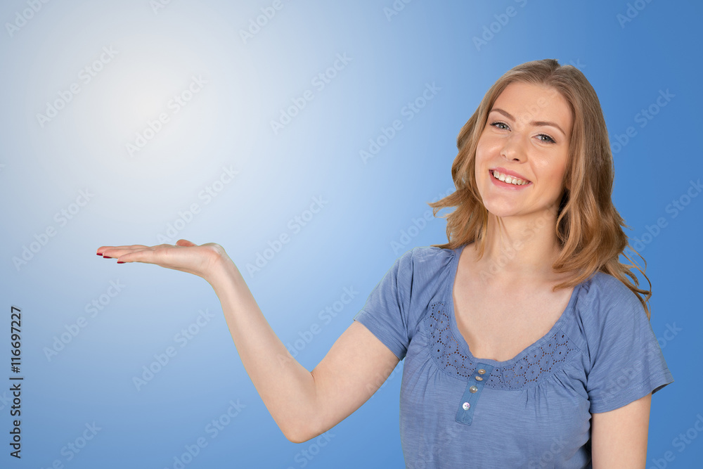 Young elegant woman pointing at white background Young elegant woman pointing at white background