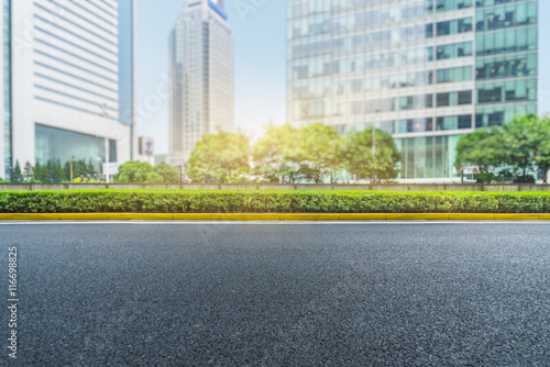 clean asphalt road with city skyline background,china.