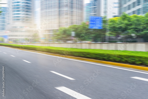 clean asphalt road with city skyline background china.
