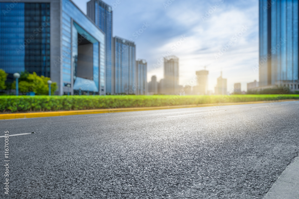 clean asphalt road with city skyline background,china. clean asphalt road with city skyline background,china.