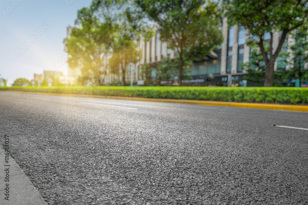 clean asphalt road with city skyline background,china. clean asphalt road with city skyline background,china.