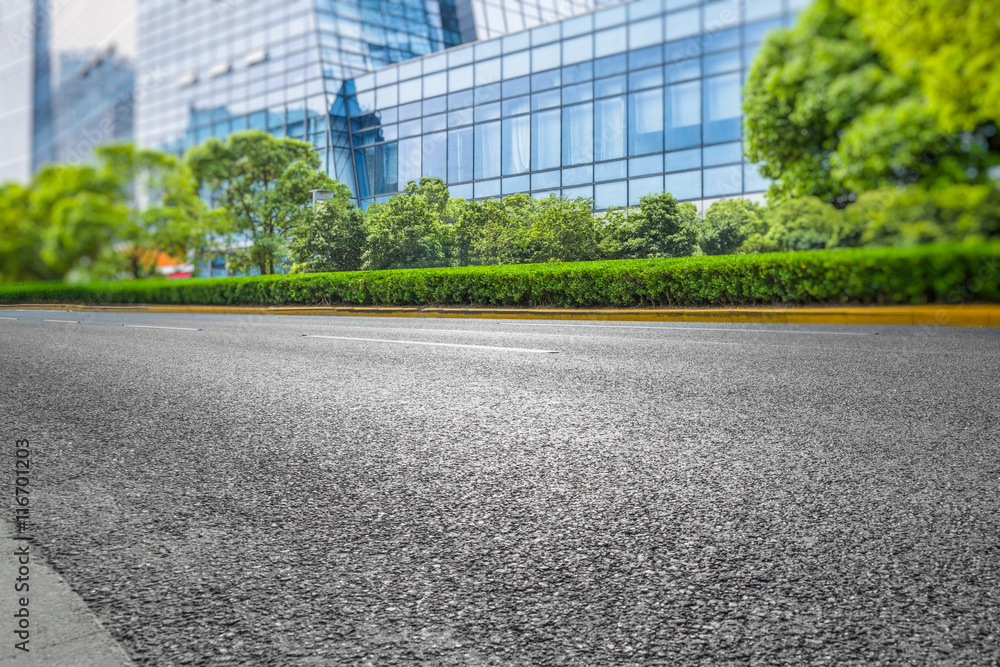 clean asphalt road with city skyline background,china. clean asphalt road with city skyline background,china.