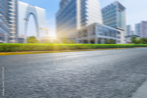 clean asphalt road with city skyline background china.