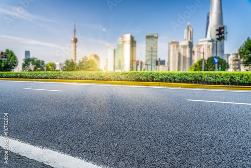 clean asphalt road with city skyline background,china.