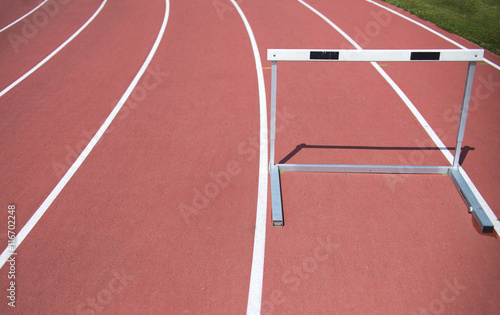 red race track and hurdle in athletic lines