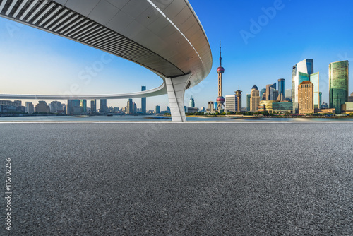 Photography clean asphalt road with city skyline background,china.