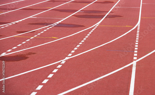 red running athletic track  bad weather  wet