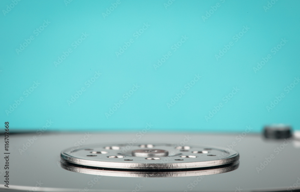real open computer hard drive on a blue background real open computer hard drive on a blue background