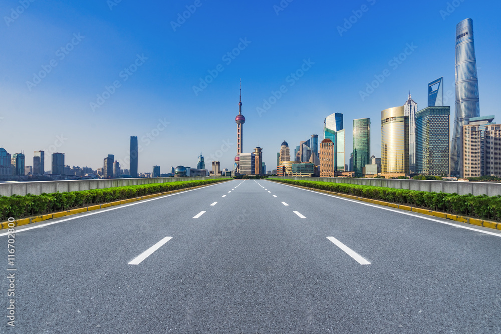 Fototapeta premium clean asphalt road with city skyline background,china.