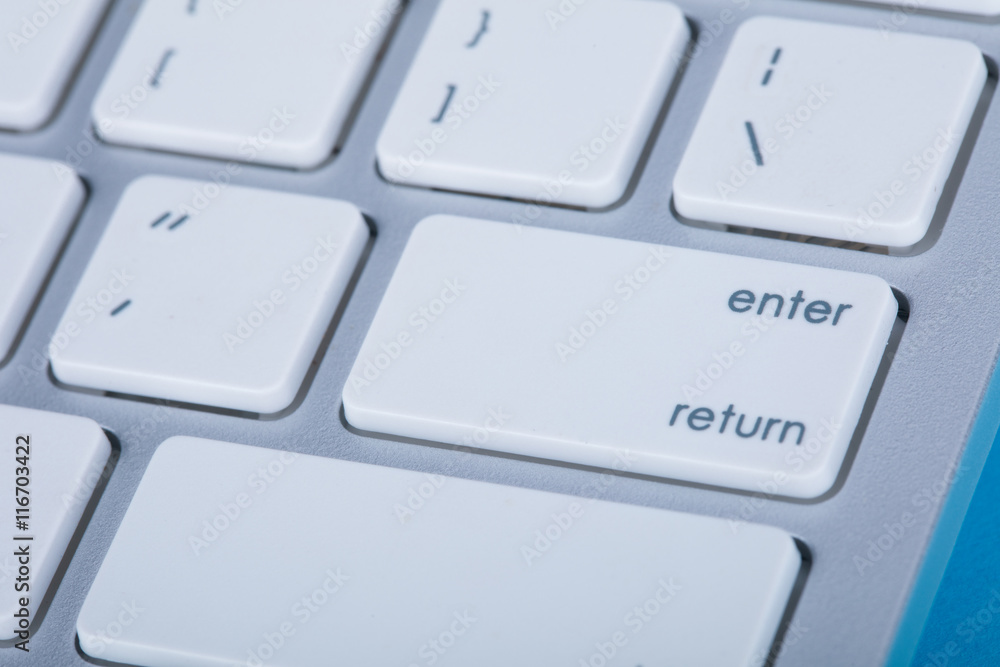 Computer keyboard on blue background Computer keyboard on blue background