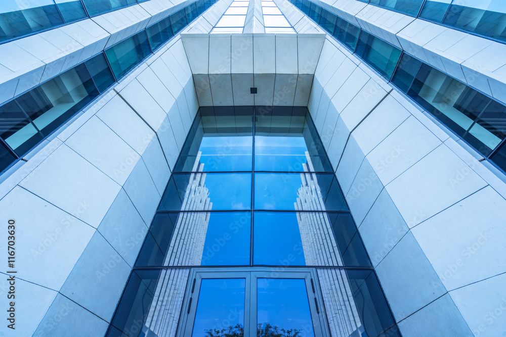 Obraz premium modern office building,blue toned image,china.