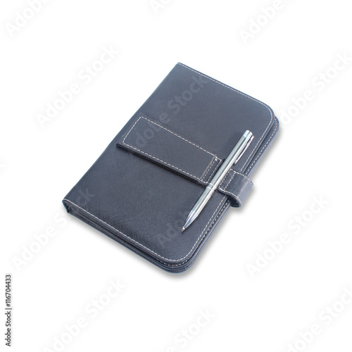 Pen put on diary cover isolate on white background