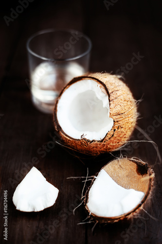 Fresh Coconut over dark wooden background. Close up of coco nut