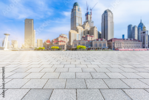 Empty brick floor with city skyline and cityscape background