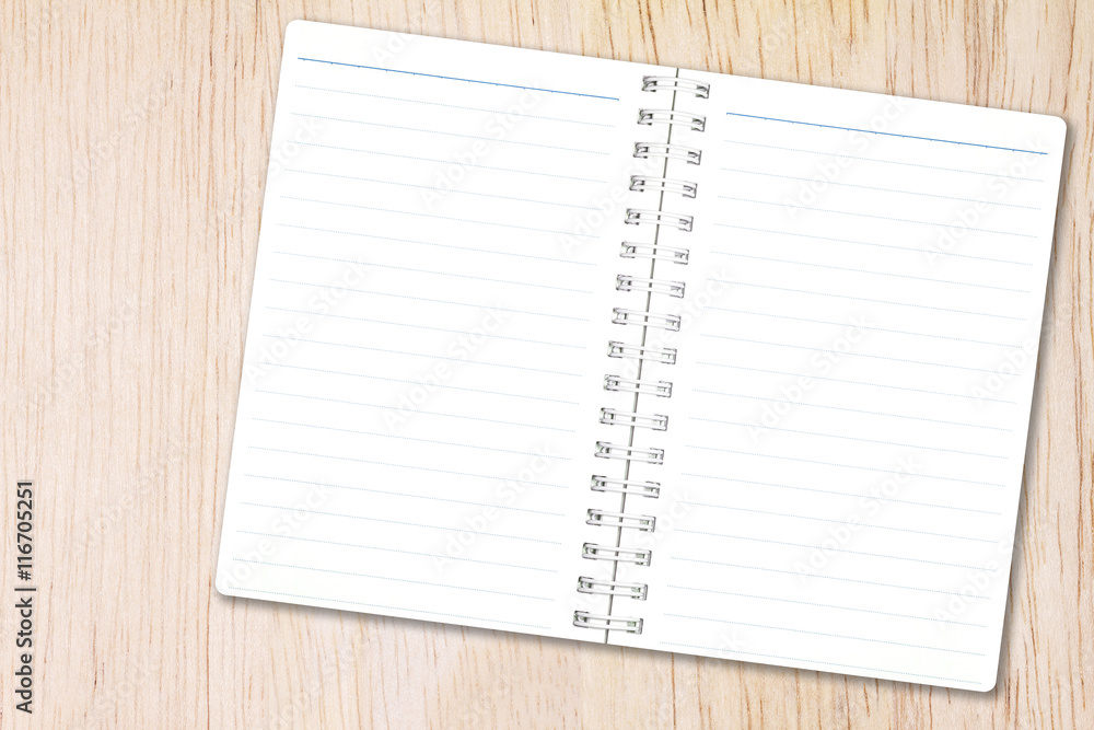 Open notebook paper with line on nature wood background for design with copy space for text or image. Open notebook paper with line on nature wood background for design with copy space for text or image.