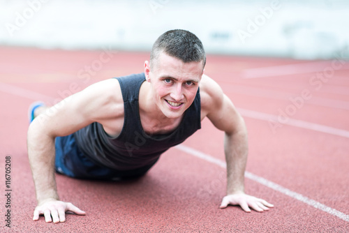 Handsome fit man exercising push up