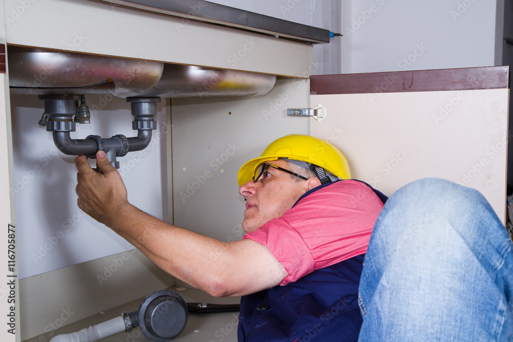 plumber at work with a sink plumber at work with a sink