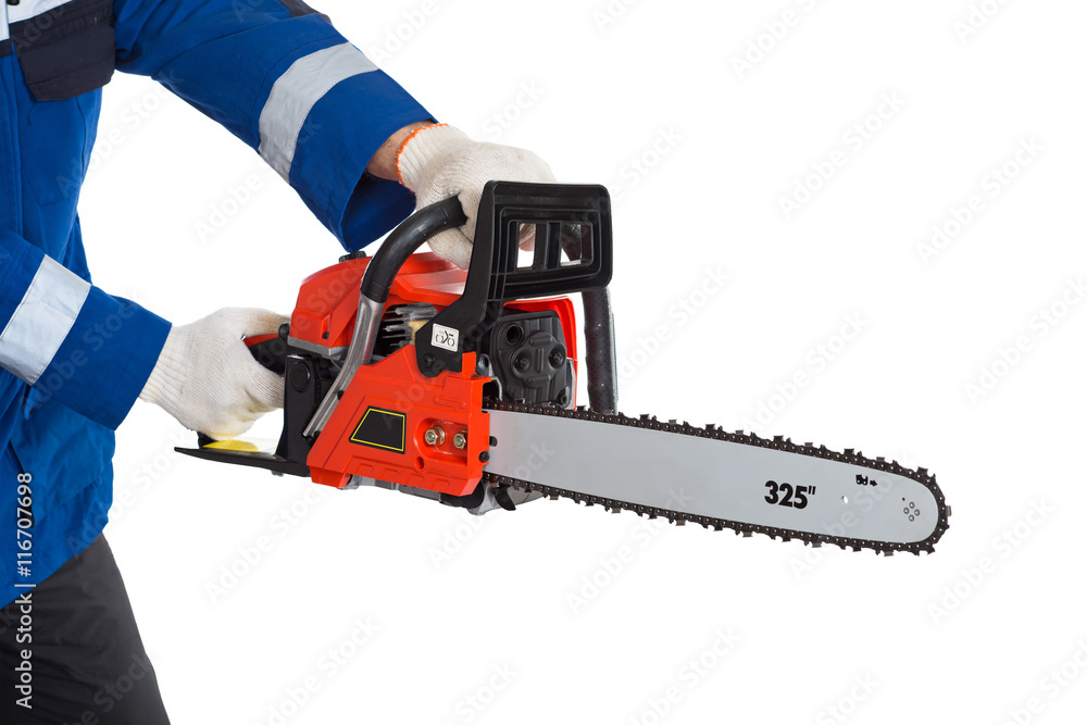 Chainsaw in hand saws a log. isolated