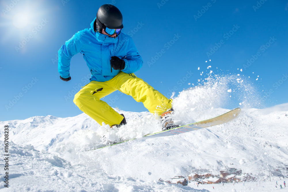 Active snowboarder in mountains