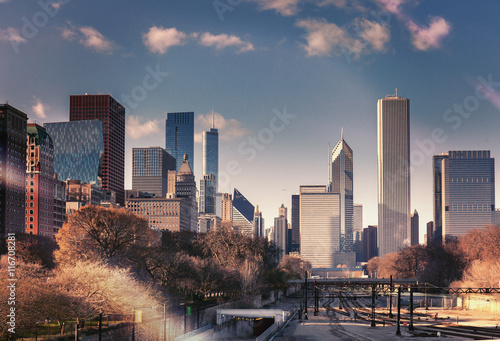 Color vintage tinted snapshot of silhouette of Chicago skyline. Downtown cityscape with skyscrapers and railway. Illinois, USA.