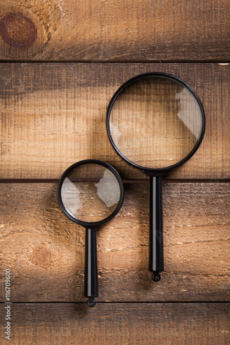 blank brown board and a magnifying glass