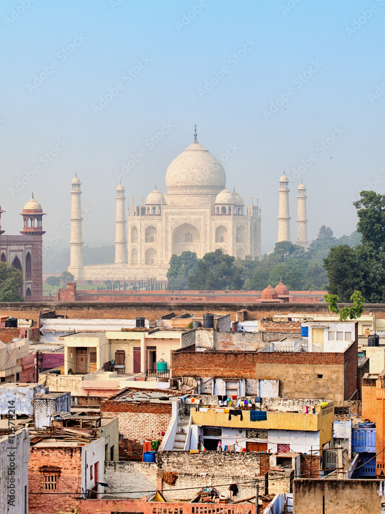 Poor neighborhoods and luxurious Taj Mahal. Agra, India