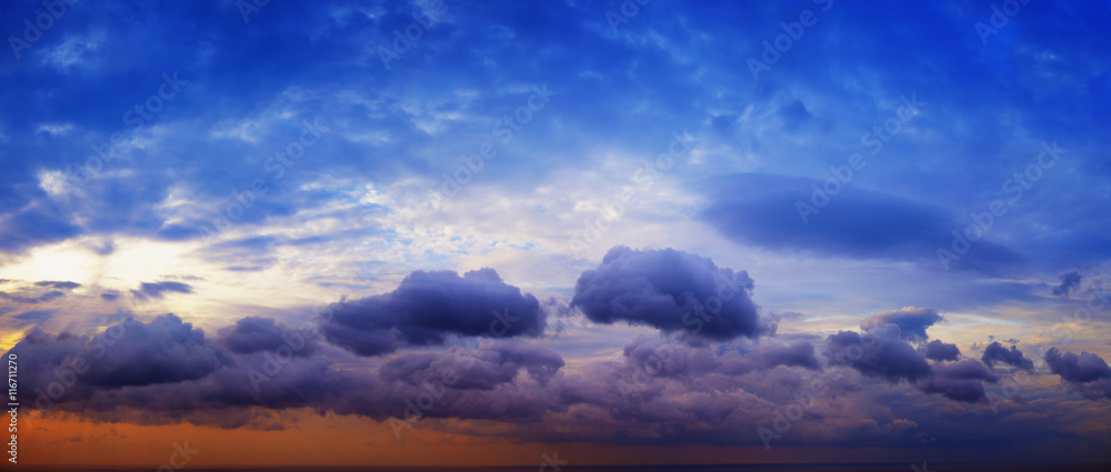 Panorama of beautiful cloudy sky with sunshine over the sea hori