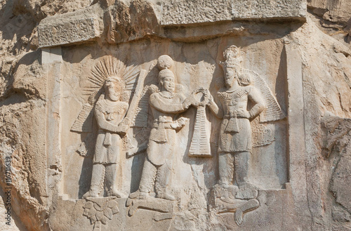 Persian kings on stone relief of the monument Taq-e Bostan in Iran. Taq-e Bostan is rock relief from 4 century photo