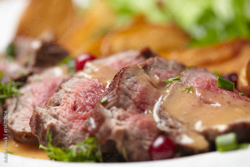 Tasty roasted pork meat with potatoes Tasty roasted pork meat with potatoes