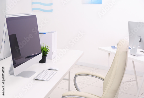 Modern computer on white wooden table in office © Africa Studio