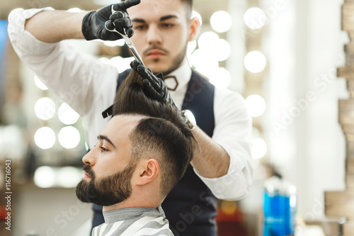 Barber doing haircuts for client