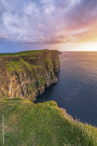 Cliffs of Moher (Aillte an Mhothair), Doolin, County Clare, Munster province, Ireland, Europe. Sunset over the cliffs. photo