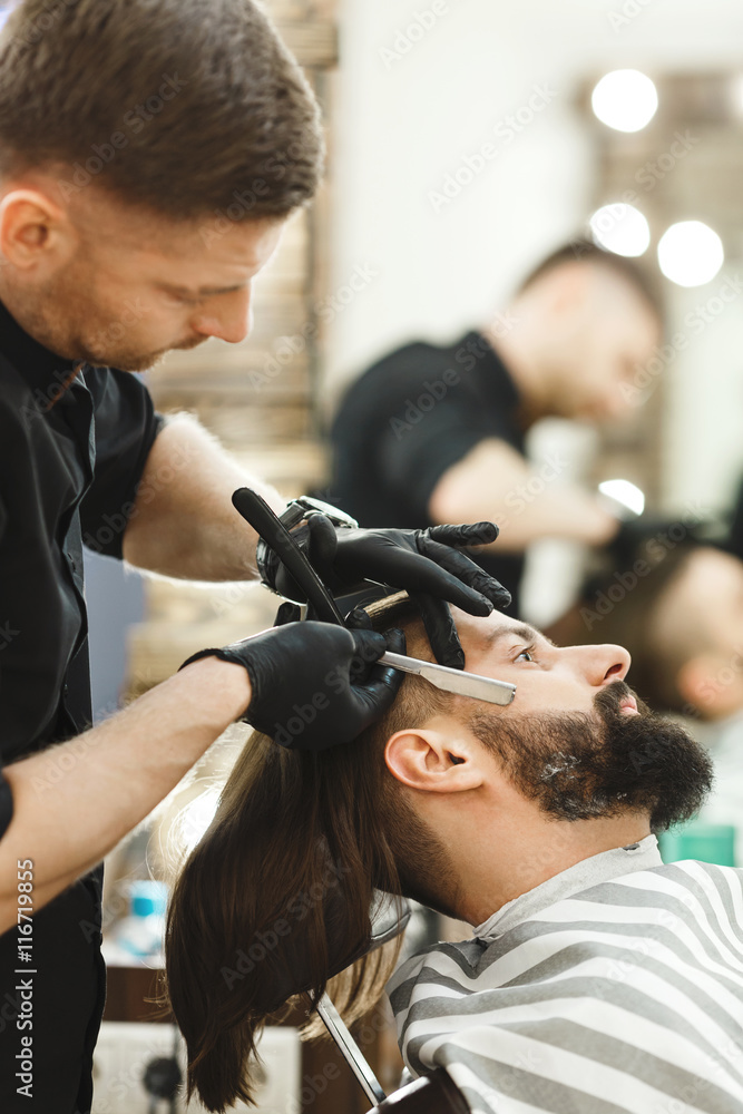 Barber making beard form for man Barber making beard form for man