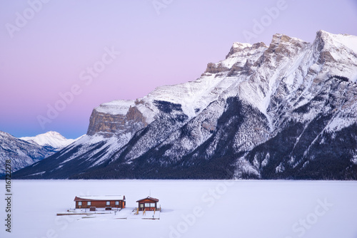 Houses against snowcapped mountain