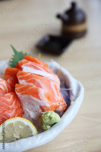 salmon sashimi on wood background japanese food