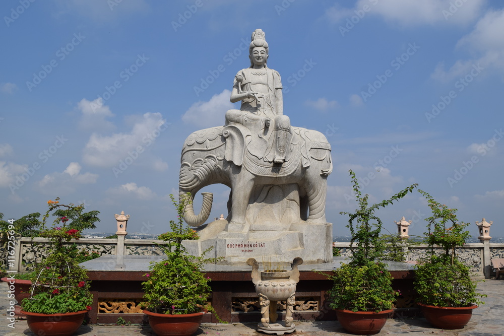 statue of buddha riding elephant in Chau Thoi temple in Binh Duong province, Vietnam