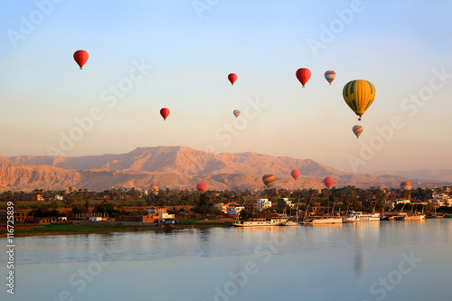 Hot air balloons in Luxor at sunrise photo