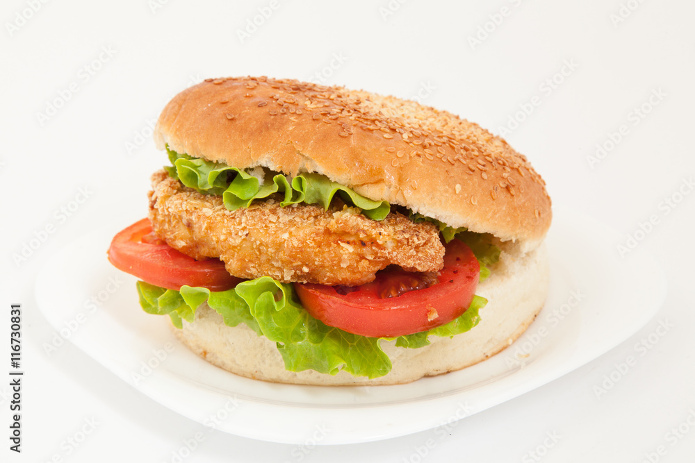 Classic chicken hamburger on white plate Classic chicken hamburger on white plate