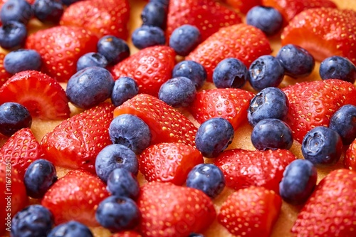 Closeup of strawberry and huckleberry cake