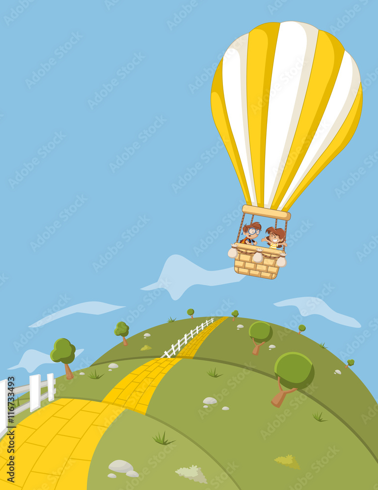 Fototapeta premium Cartoon kids inside a hot air balloon flying over green hills with a yellow brick road.