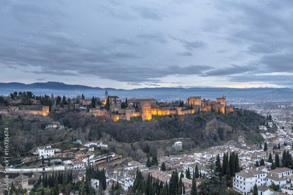 Ancient arabic fortress of Alhambra palace and fortress complex at dusk in Granada. Andalusia, Spain