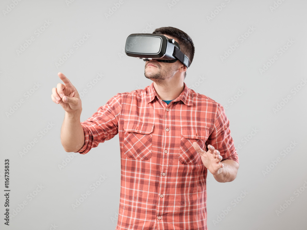 Man with virtual reality glasses showing gesture Man with virtual reality glasses showing gesture