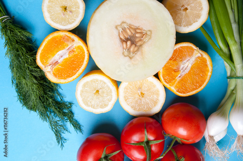 Healthy vegetables and fruits on a blue background