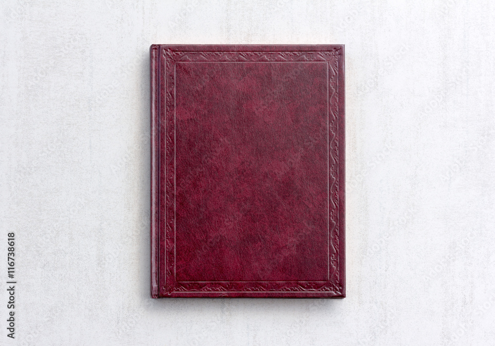 book dark purple color on gray background close-up, top view book dark purple color on gray background close-up, top view