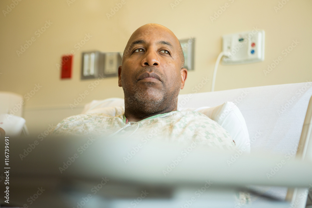 Fototapeta premium African American man in a hospital bed.