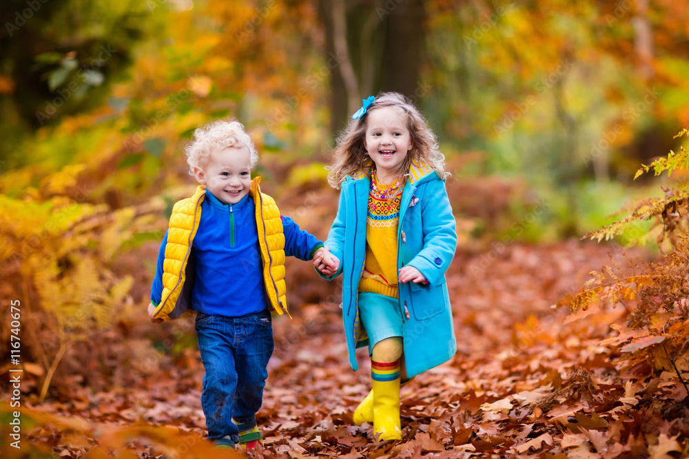 Kids playing in autumn park Kids playing in autumn park