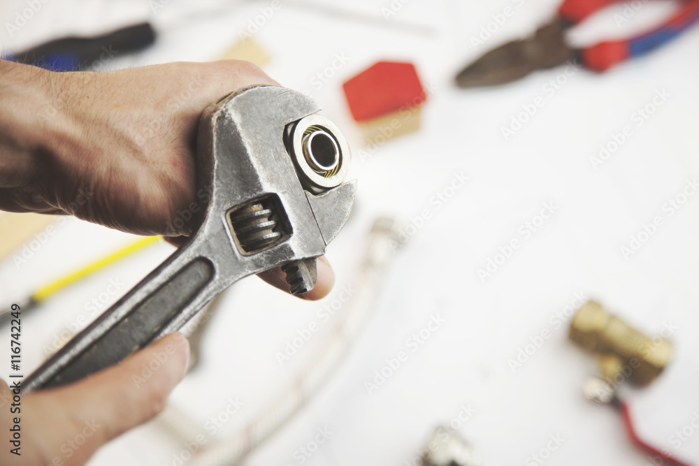 Fototapeta premium man repair in tools on paper