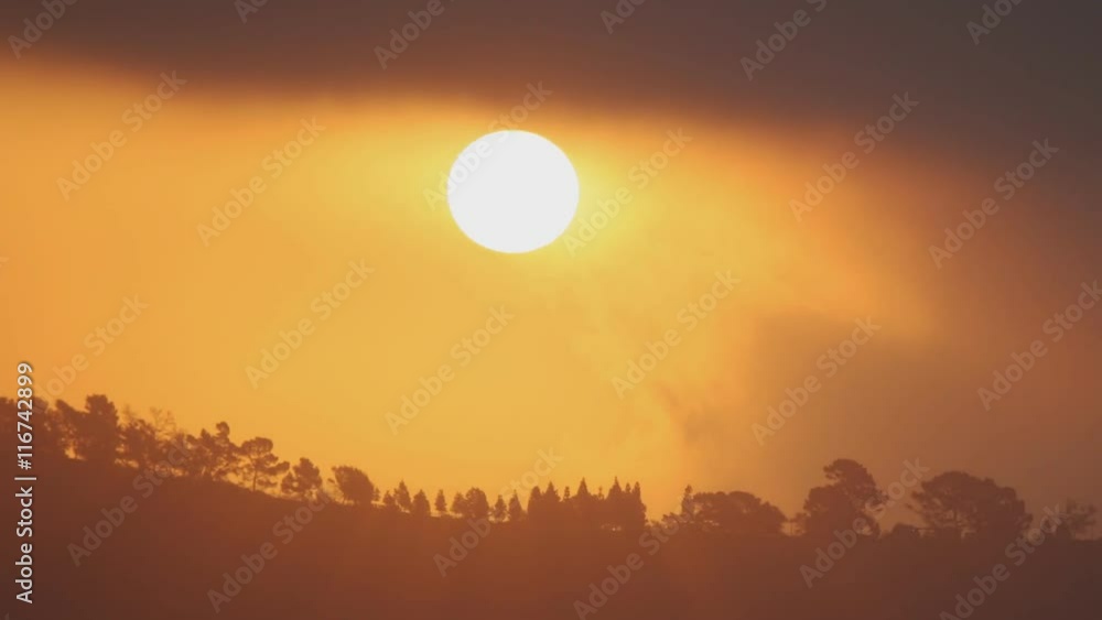 Time Lapse of the sun rising behind clouds. Time Lapse of the sun rising behind clouds.