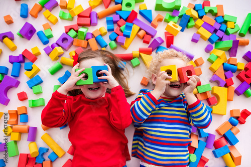 Children playing with colorful blocks.